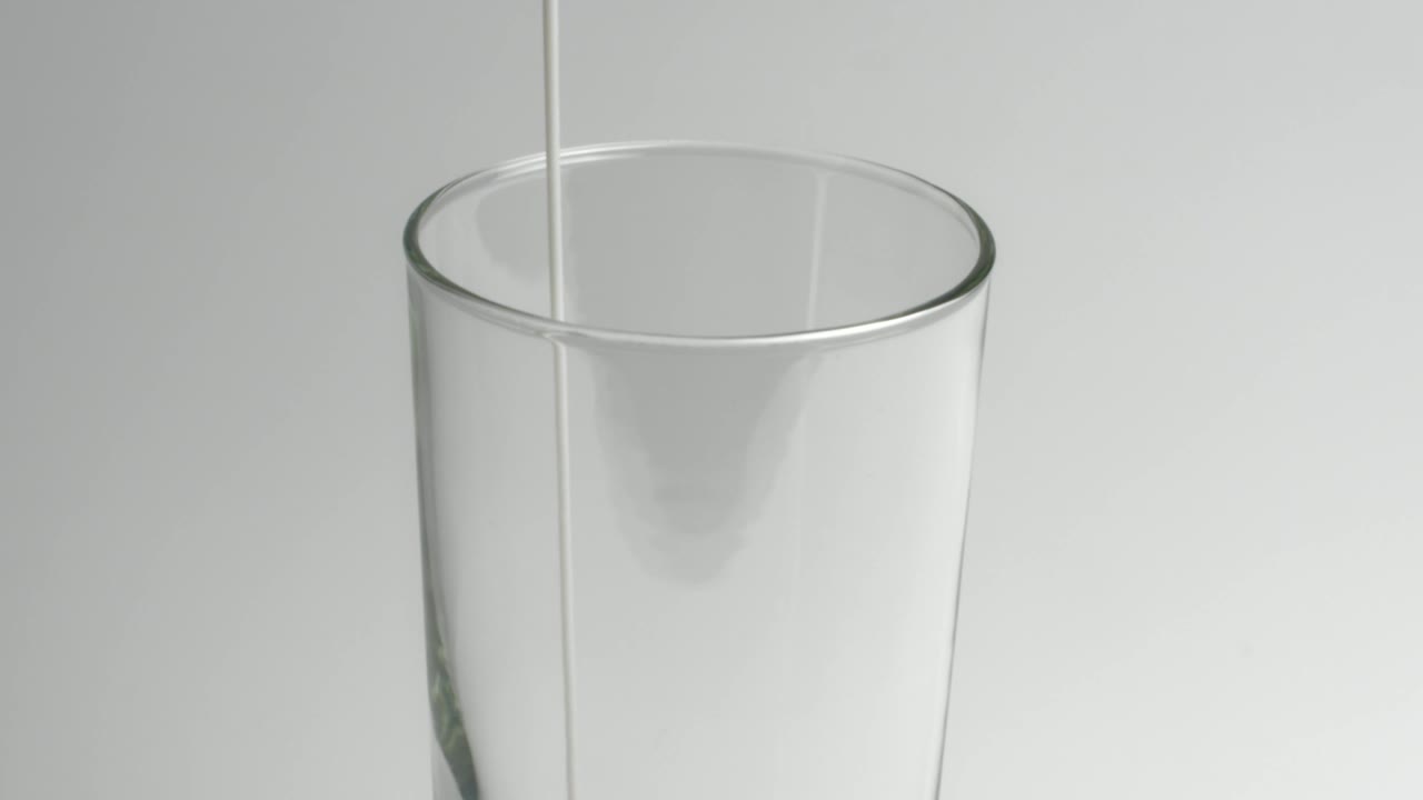 Stock Video Milk Poured Into A Transparent Glas Animated Wallpaper