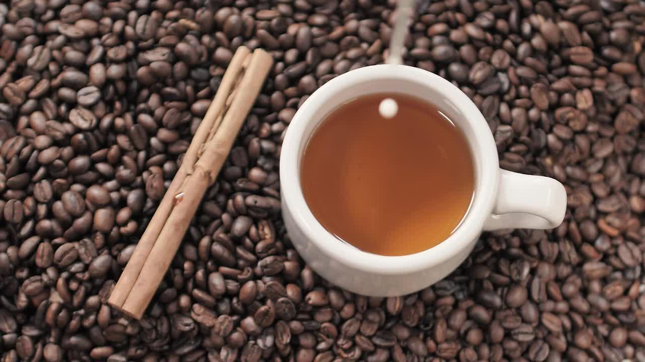 Stock Video Milk Being Poured Into A Coffee Cu Animated Wallpaper