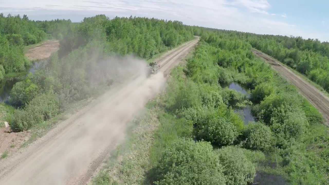 Stock Video Military Vehicle Heading Down A Dusty Roa Animated Wallpaper