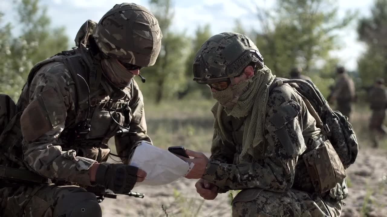 Stock Video Military Men Looking At Cell Phone And Ma Animated Wallpaper
