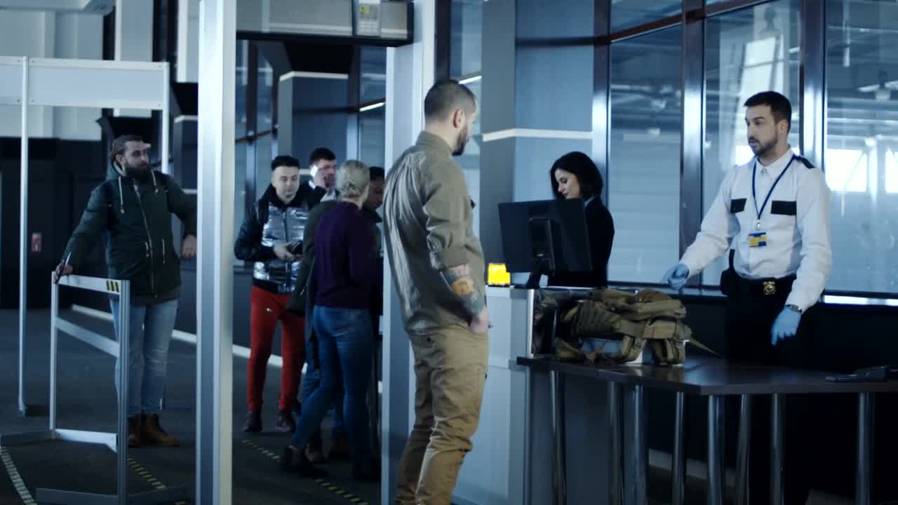 Stock Video Military Men Detain A Passenger At Airpor Animated Wallpaper