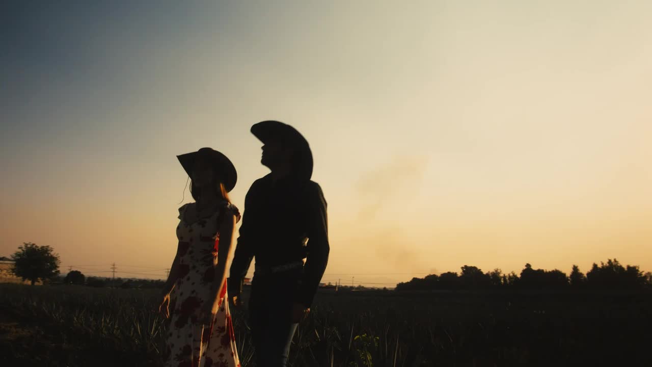 Stock Video Mexican Style Man And Woman On A Ranch At Sunse Animated Wallpaper