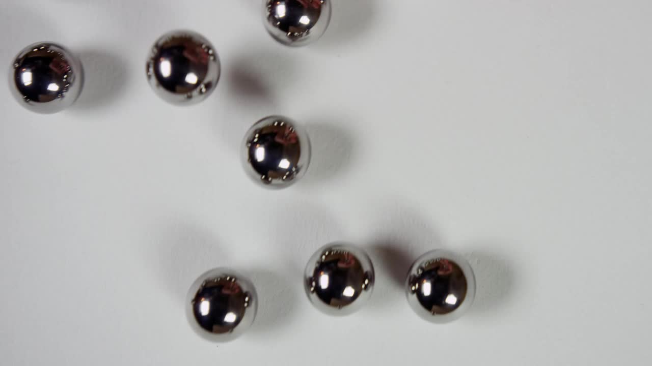 Stock Video Metal Pellets On White Surfac Animated Wallpaper