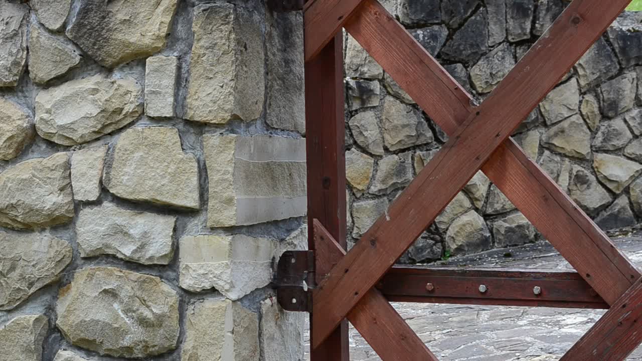 Stock Video Metal Gate Against A Stone Wal Animated Wallpaper