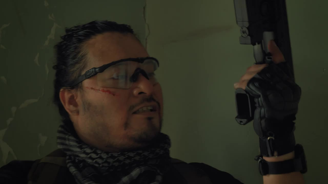 Stock Video Mercenary With A Gun In An Abandoned Plac Animated Wallpaper