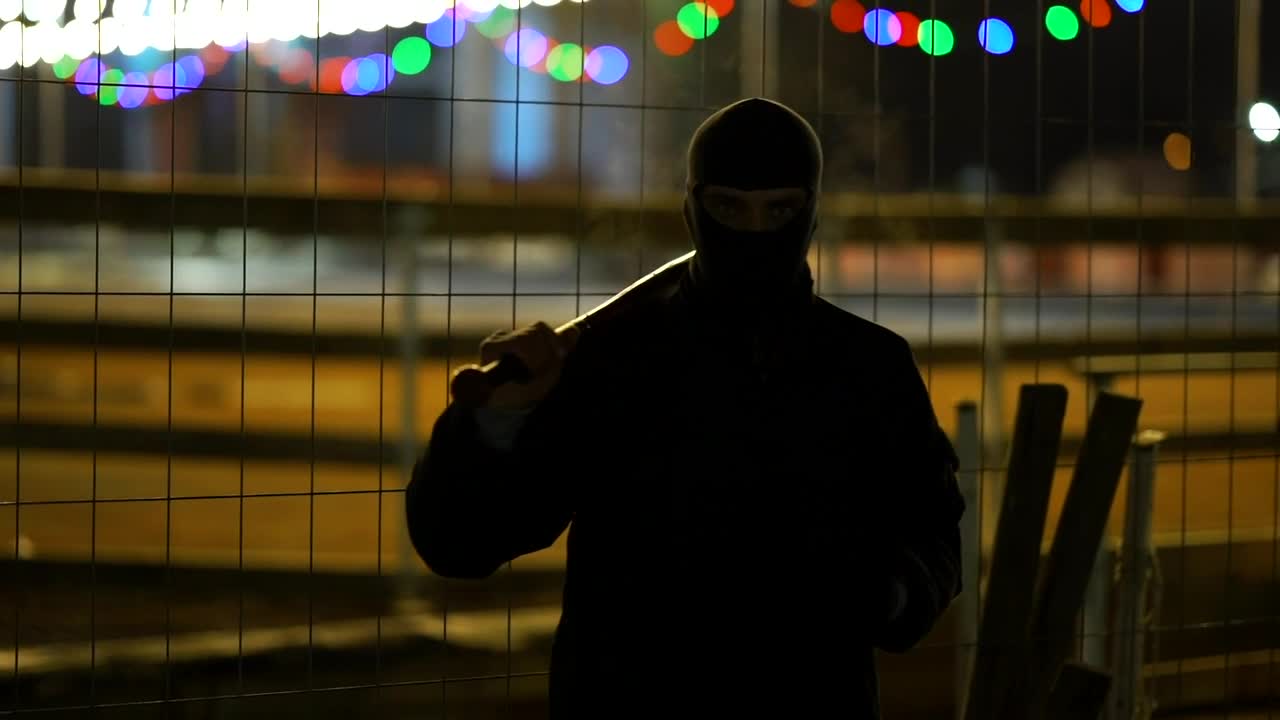 Stock Video Menacing Man With A Baseball Bat At Nigh Animated Wallpaper