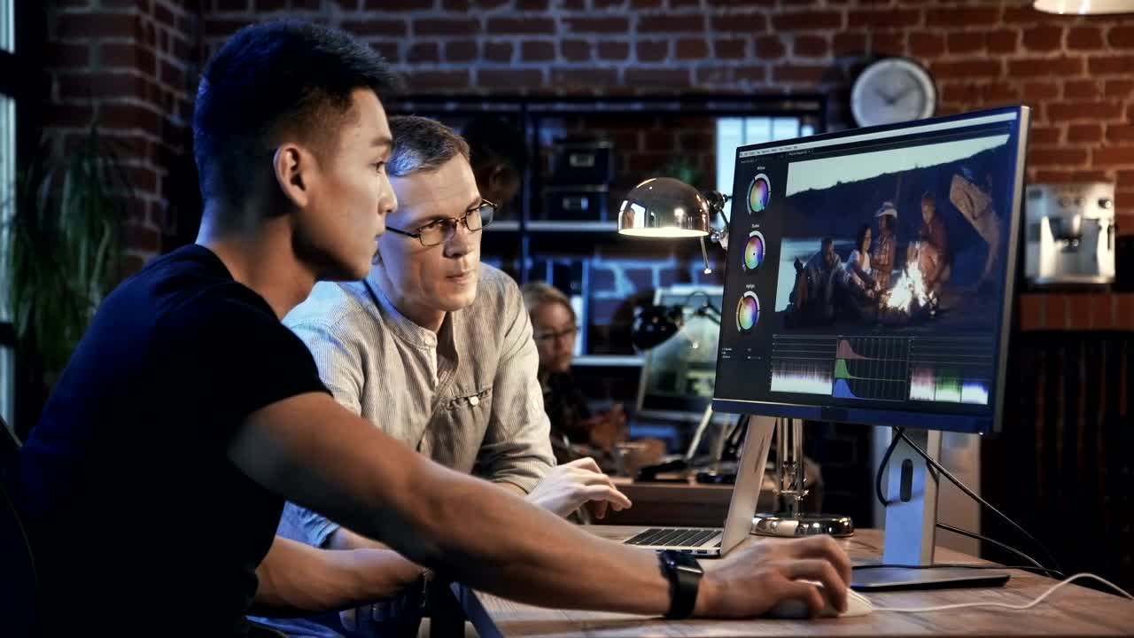 Stock Video Men Working On Video Editin Animated Wallpaper