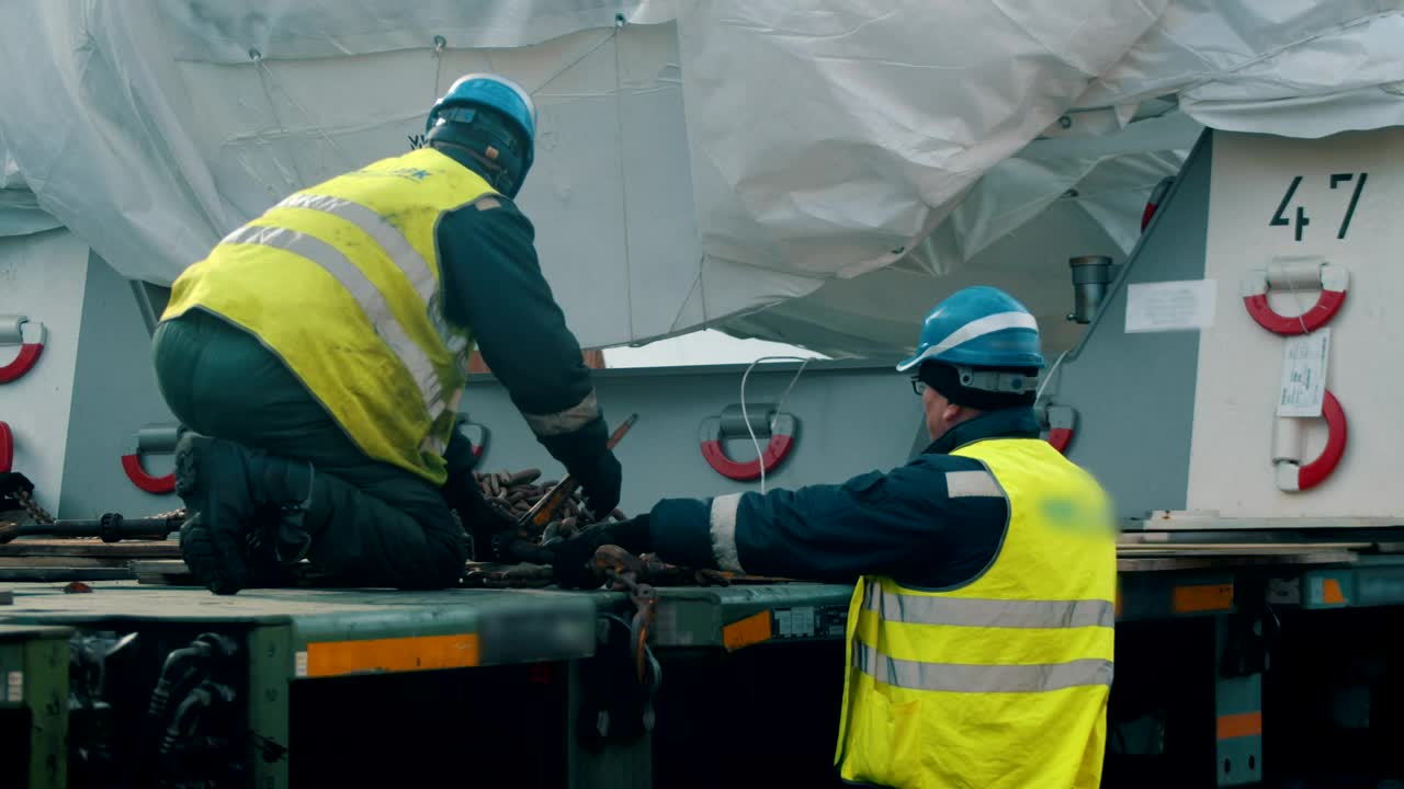 Stock Video Men With Helmet And Vests Workin Animated Wallpaper