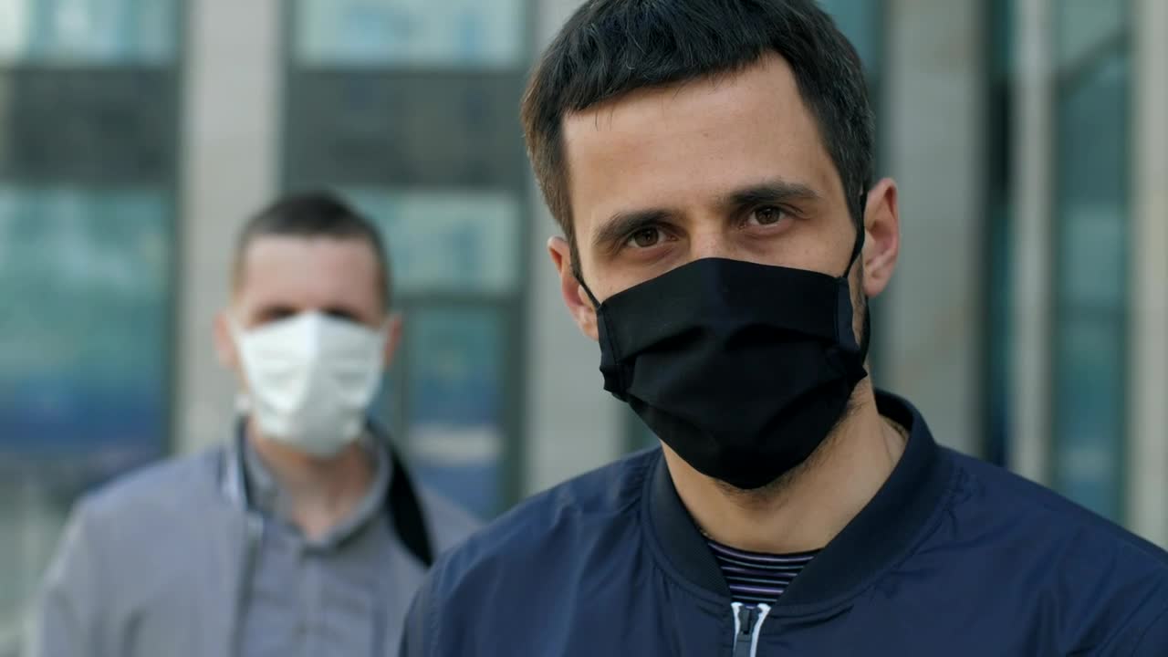 Stock Video Men With Face Masks On The Street Portrai Animated Wallpaper