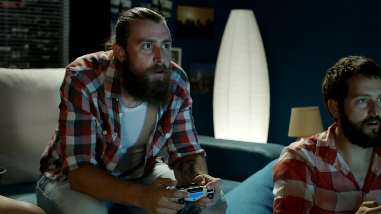 Stock Video Men Playing Video Games In The Living Roo Animated Wallpaper