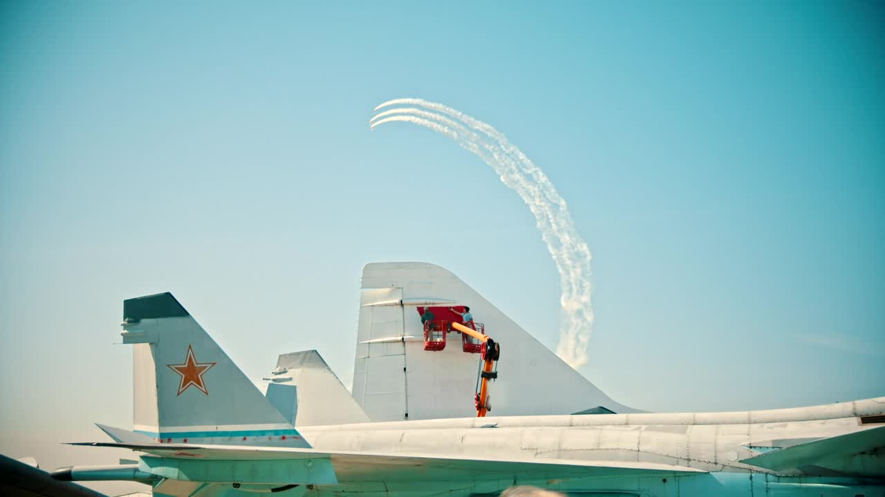 Stock Video Men Painting The Tail Of An Airplan Animated Wallpaper