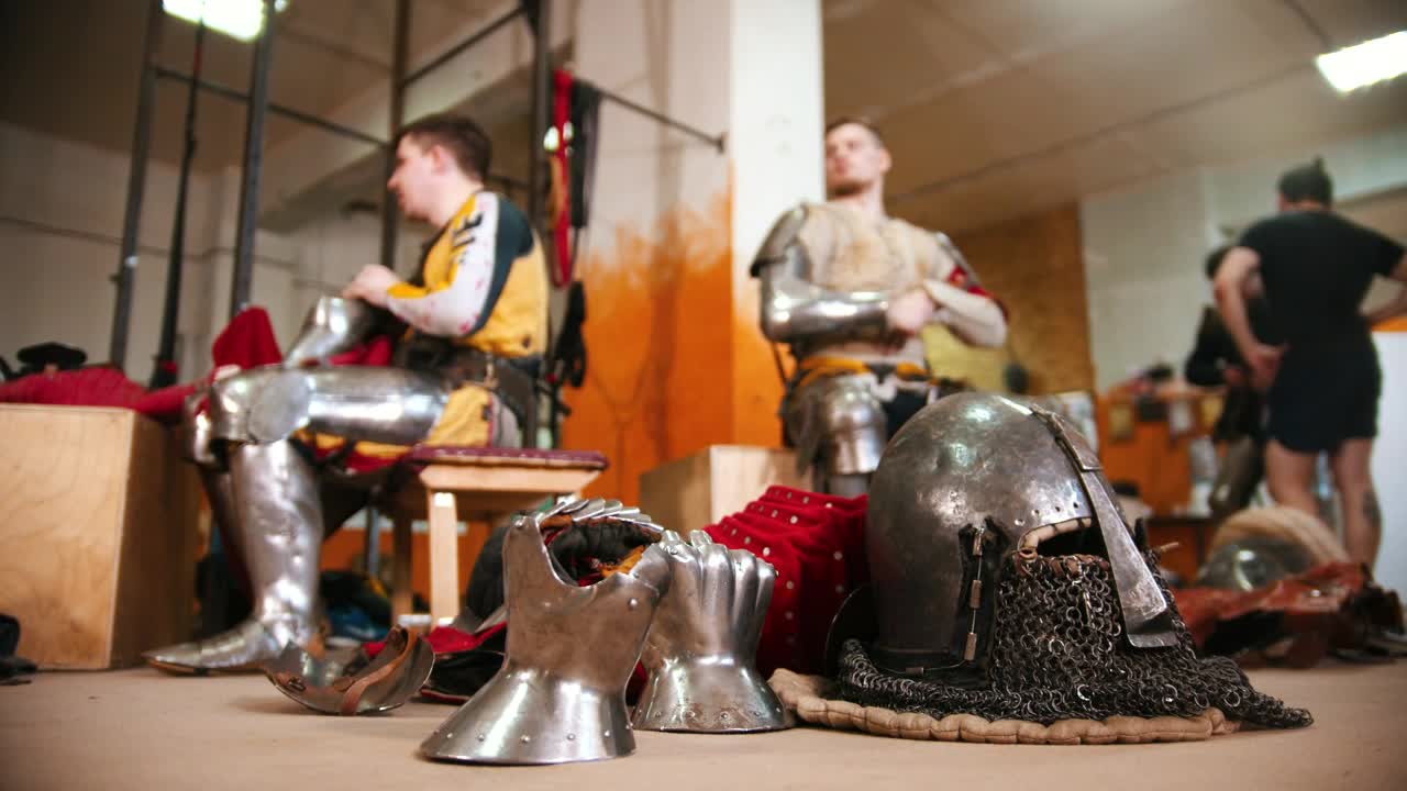 Stock Video Men In The Dressing Room Taking Off The Armo Animated Wallpaper