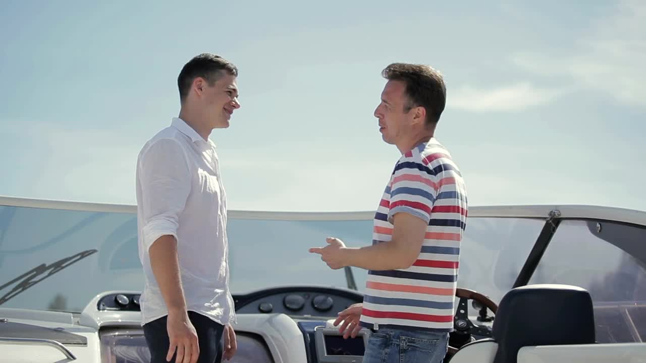 Stock Video Men Handshake Over Deal On Deck Of Yach Animated Wallpaper