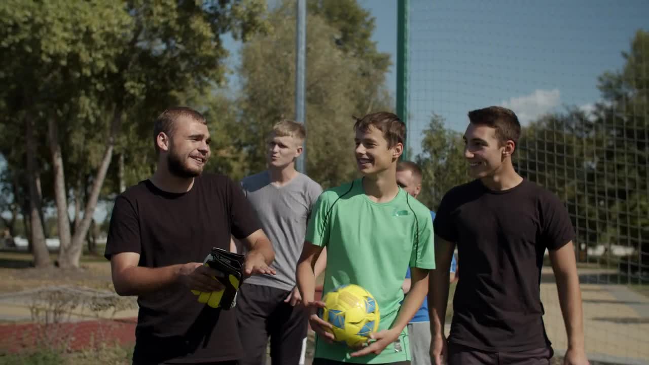 Stock Video Men Coming To Play Soccer Footbal Animated Wallpaper