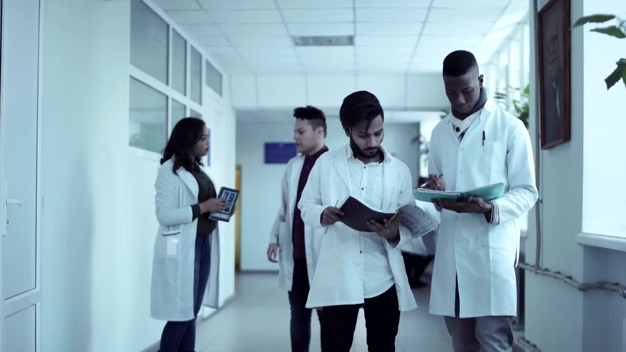 Stock Video Medical Students Converse In The Hal Animated Wallpaper