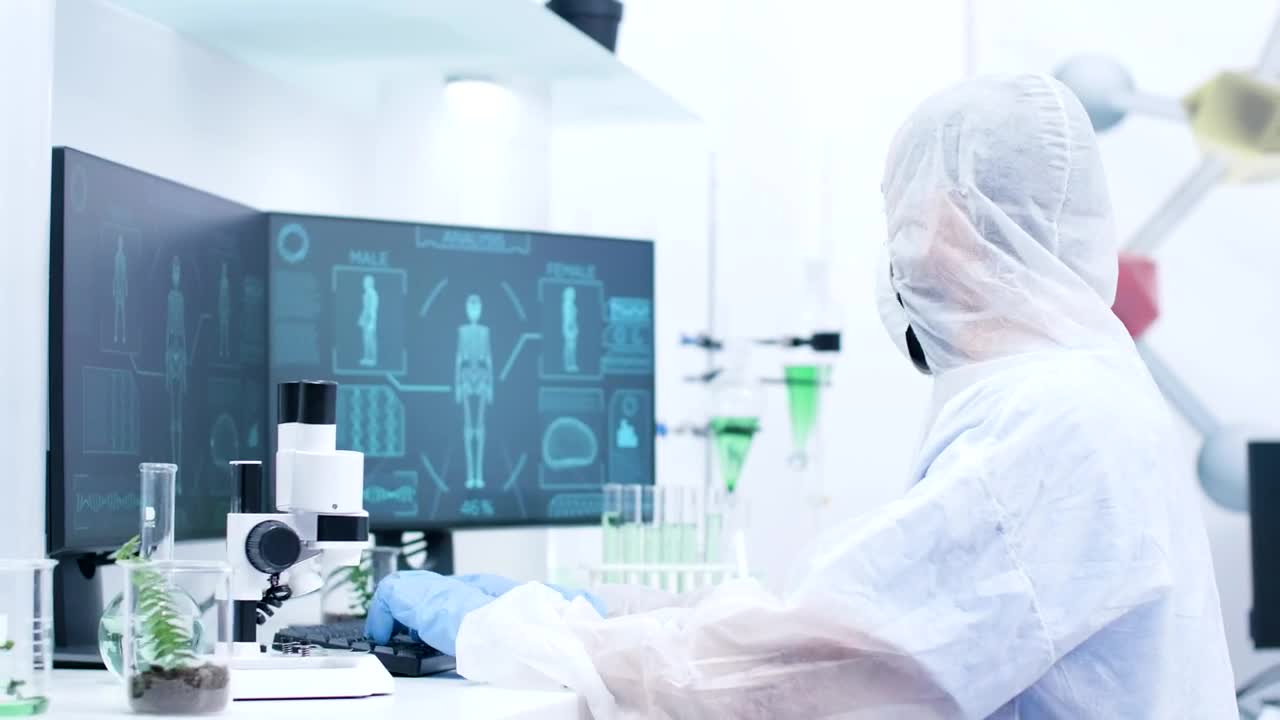 Stock Video Medical Scientist Types And Looks At Human Body Sca Animated Wallpaper