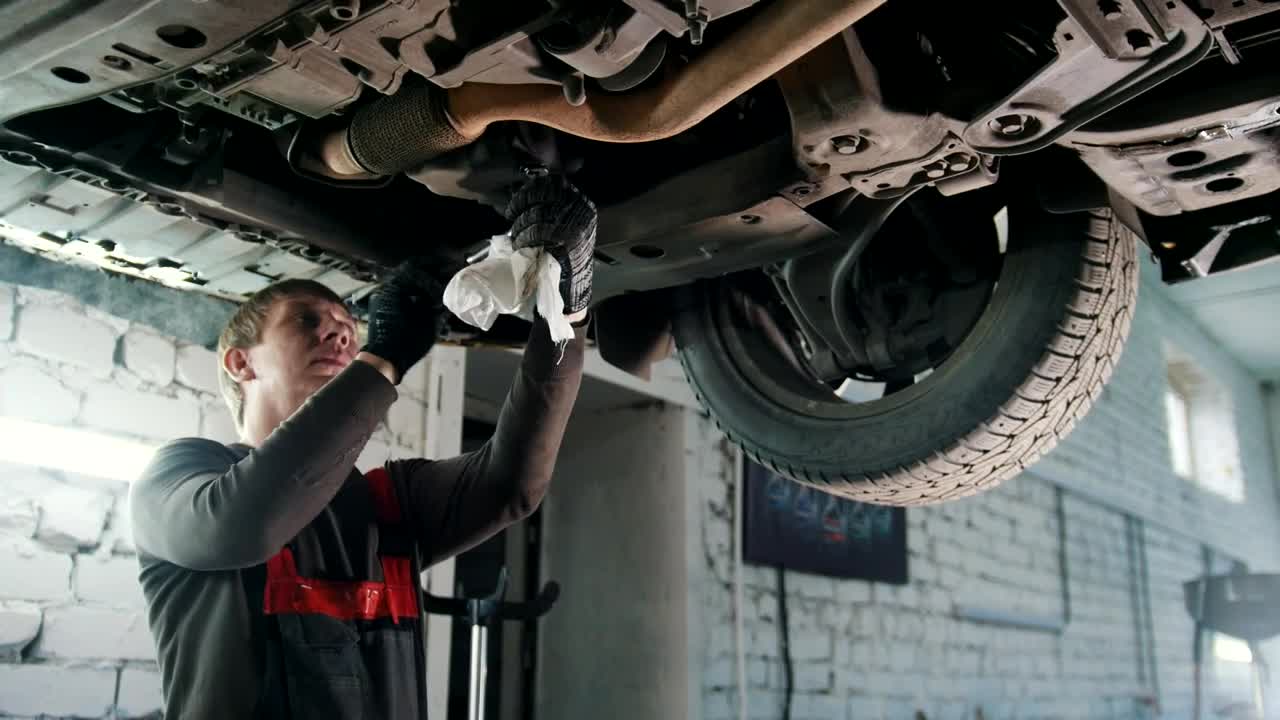 Stock Video Mechanic Working In The Bottom Of A Ca Animated Wallpaper