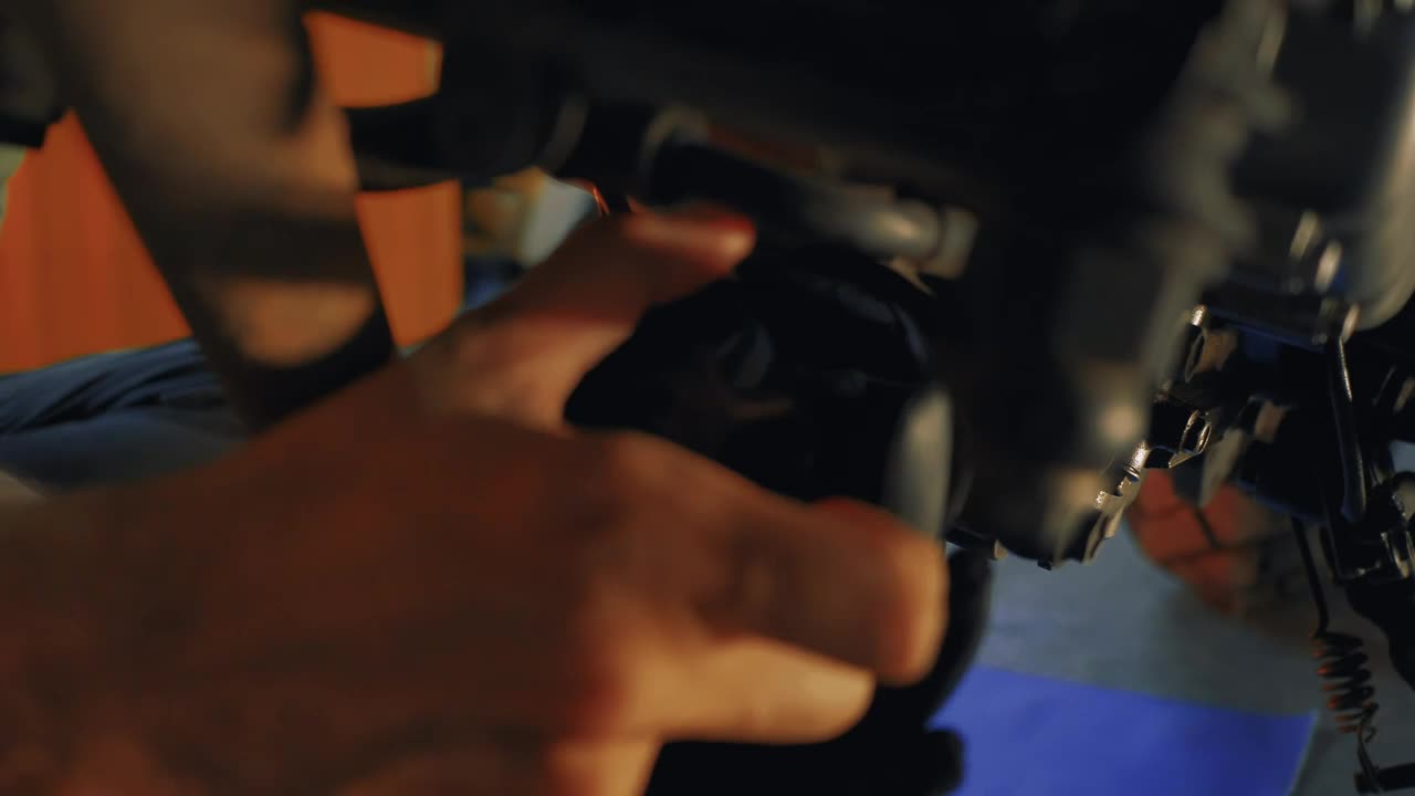 Stock Video Mechanic Maintaining A Motorcycle Engin Animated Wallpaper
