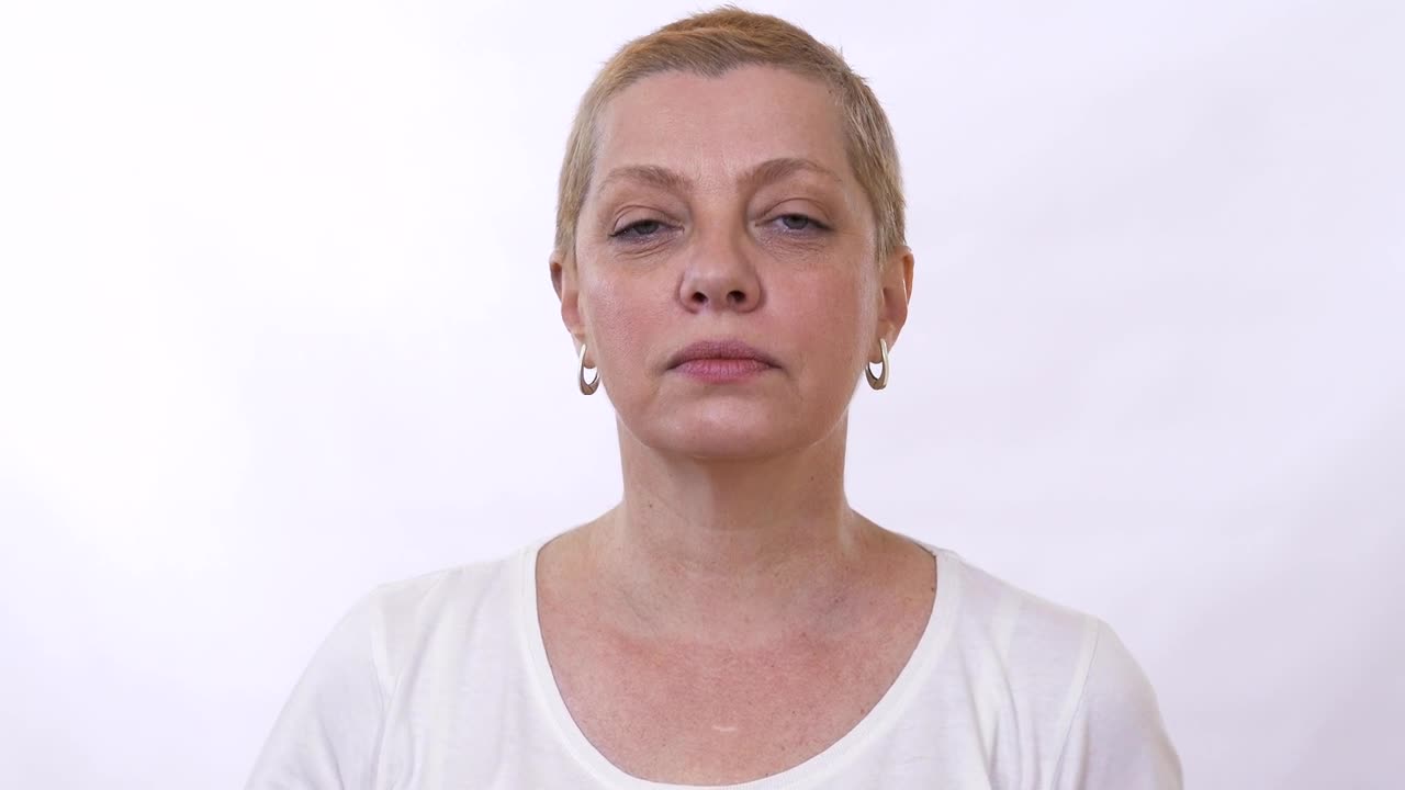 Stock Video Mature Woman Checks For Wrinkles And Massages Fac Animated Wallpaper