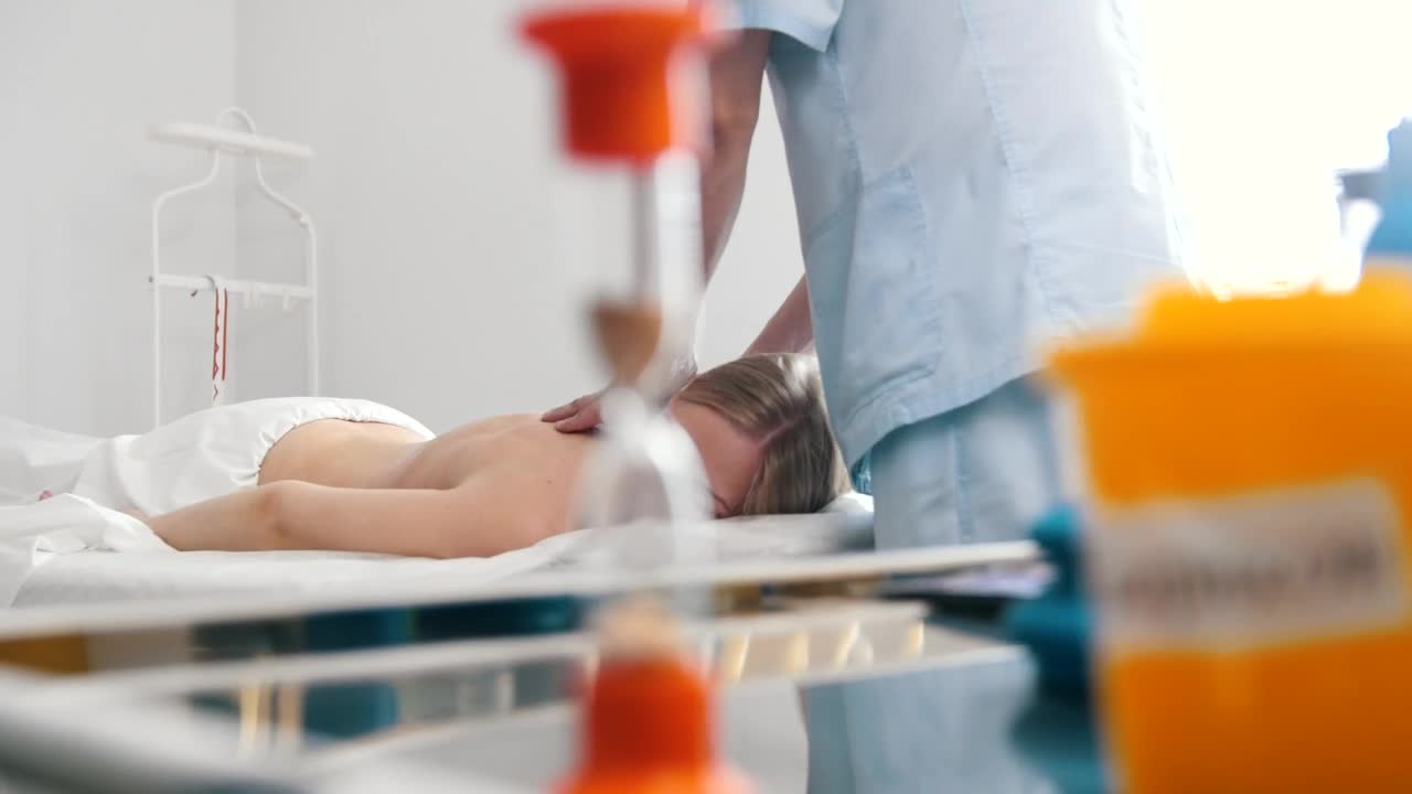 Stock Video Massaging Womans Back In The Medical Offic Animated Wallpaper