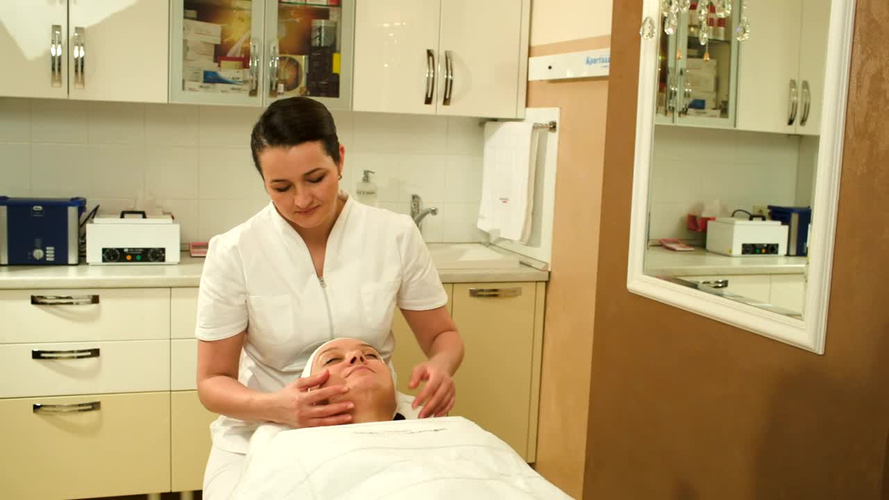 Stock Video Massage Therapist Giving A Face Massag Animated Wallpaper