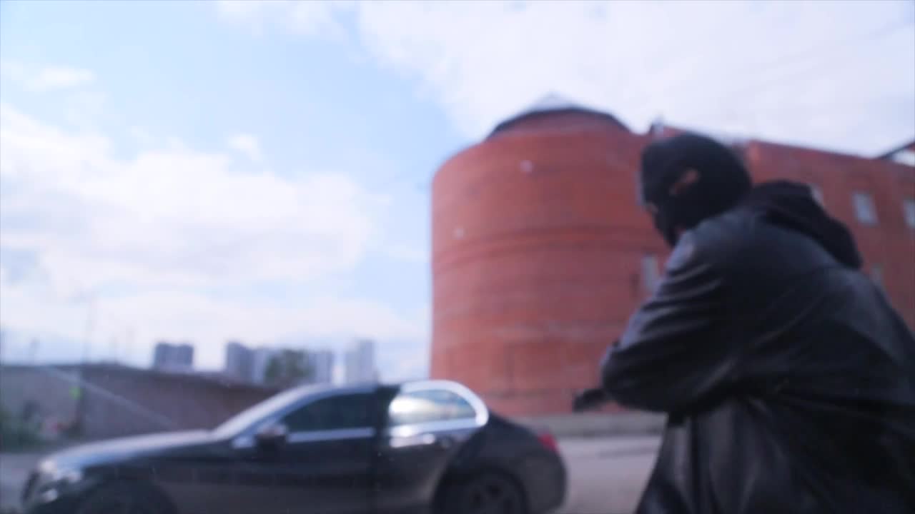 Stock Video Masked Robber Smashing A Windo Animated Wallpaper