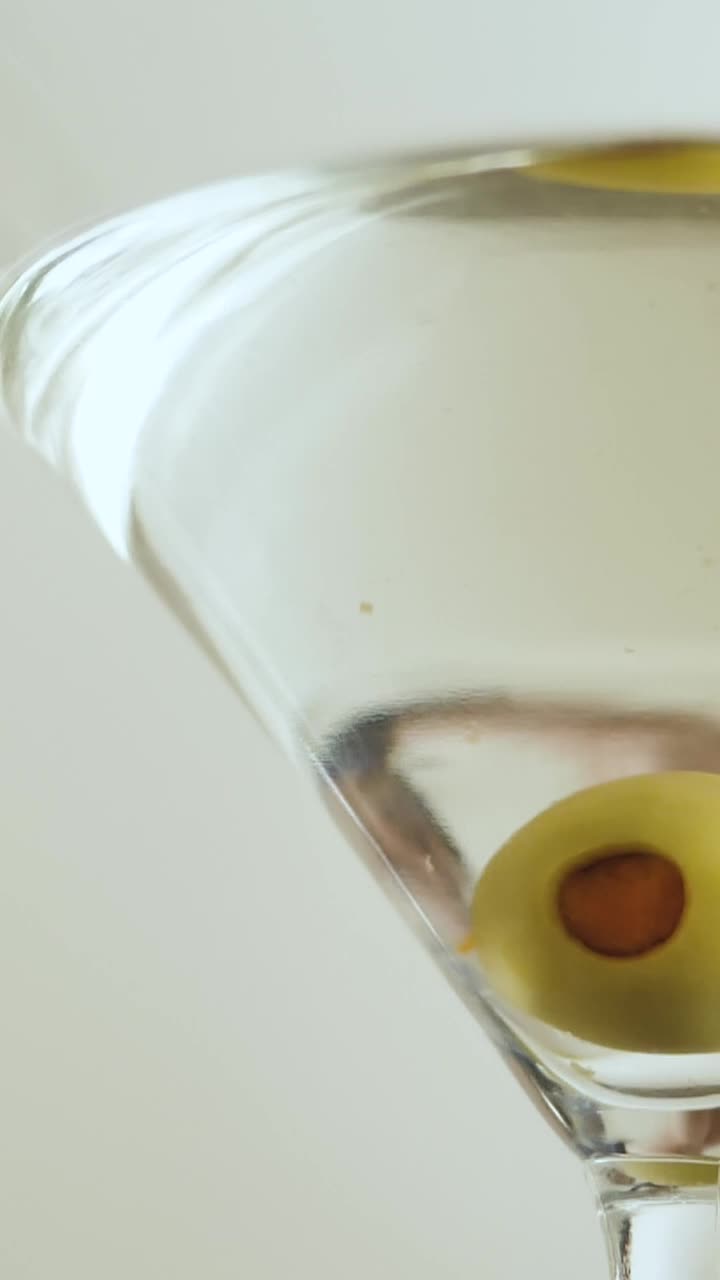 Stock Video Martini Cocktail With Olive Animated Wallpaper