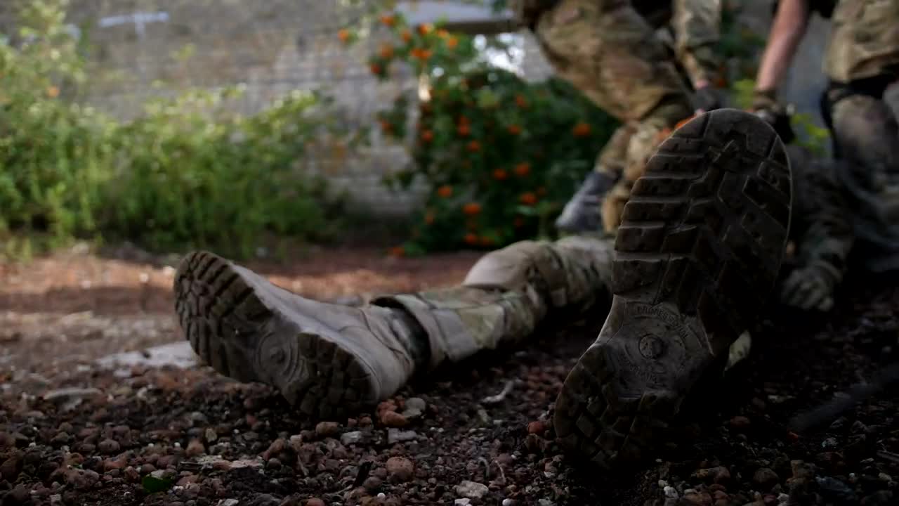 Stock Video Marines Dragging An Injured Ma Animated Wallpaper