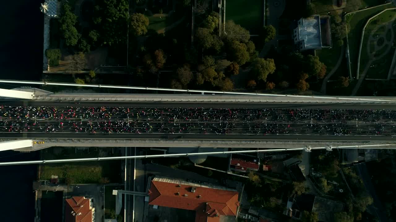 Stock Video Marathon Runners Crossing A Bridg Animated Wallpaper