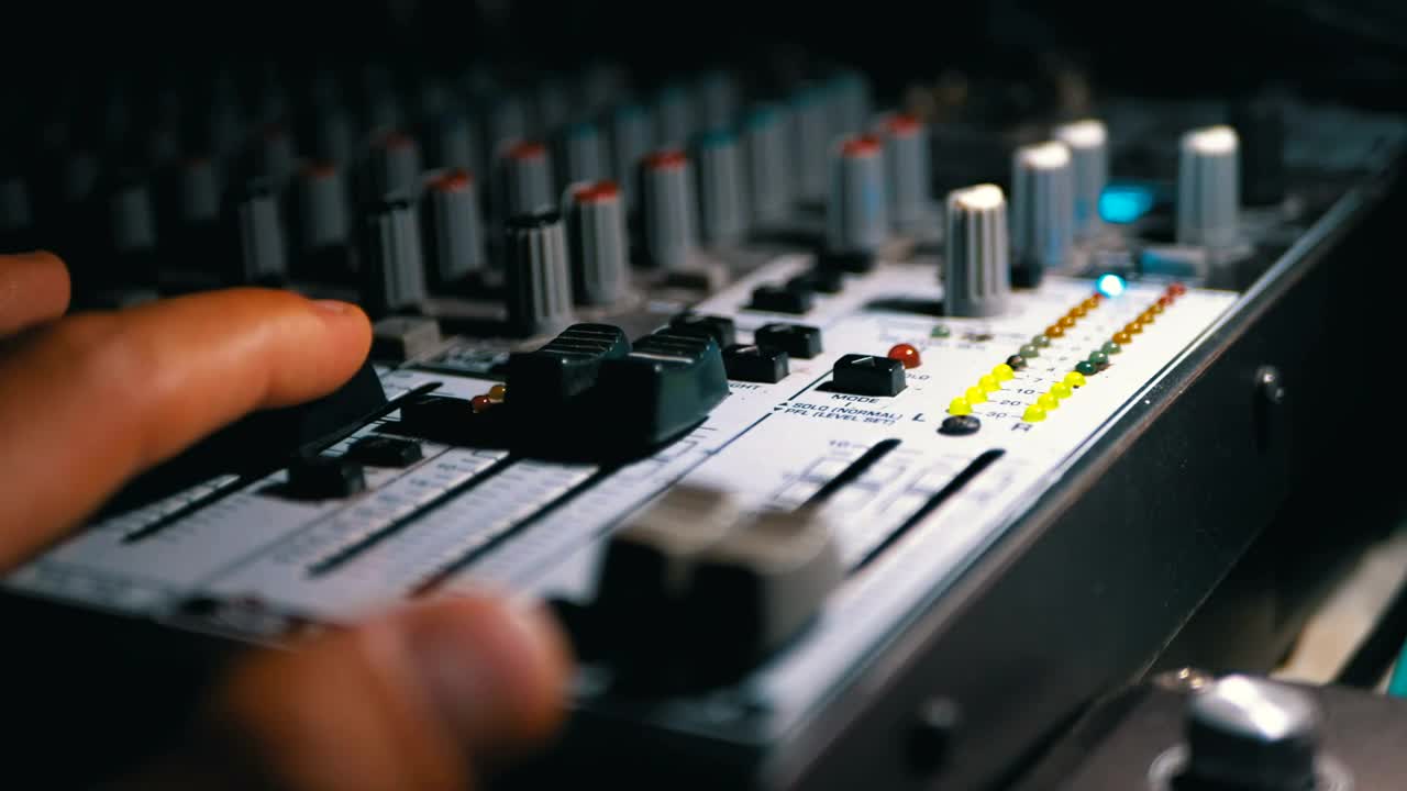 Stock Video Mans Hand Working On A Sound Mixing Consol Animated Wallpaper