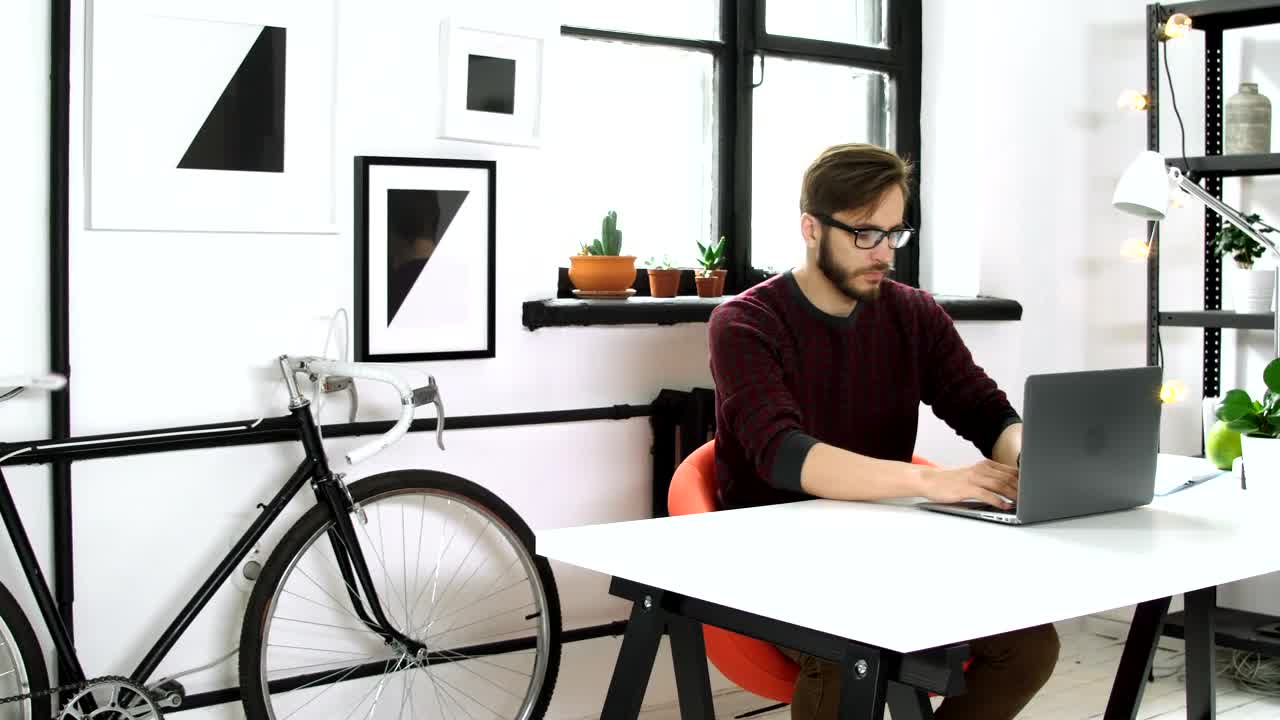 Stock Video Man Working On His Laptop On A Startup Environmen Animated Wallpaper