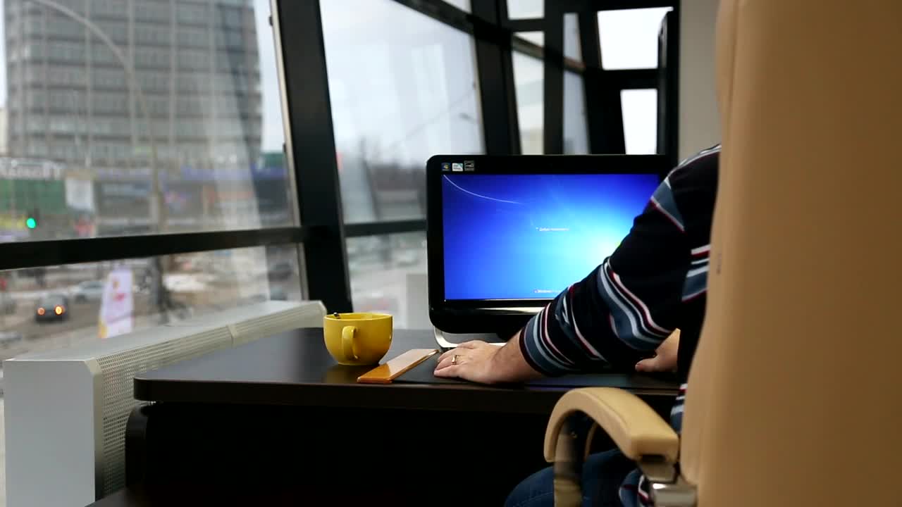 Stock Video Man Working On His Computer By The Windo Animated Wallpaper
