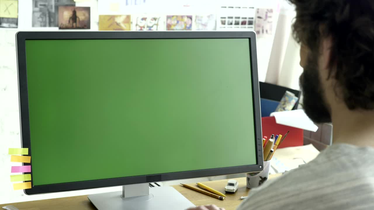 Stock Video Man Working On A Computer With A Green Scree Animated Wallpaper