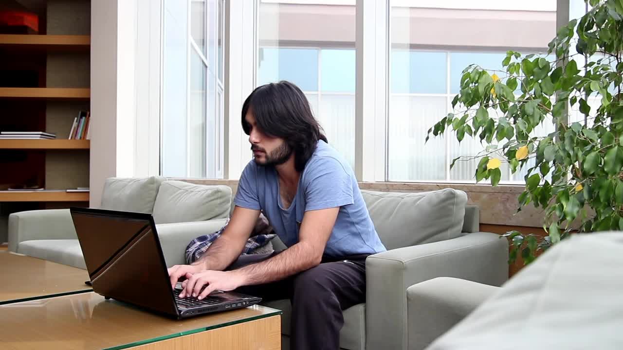 Stock Video Man Working On A Computer In A Roo Animated Wallpaper