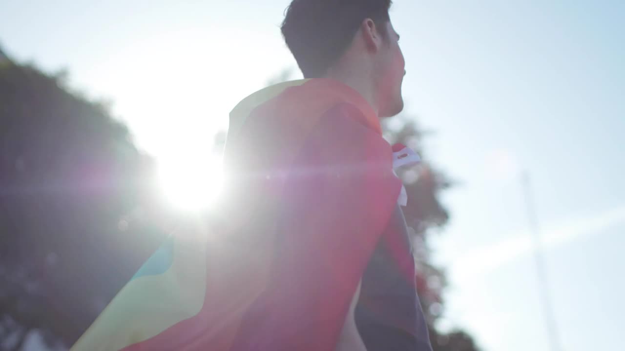 Stock Video Man With Pride Rainbow Flag Around His Nec Animated Wallpaper