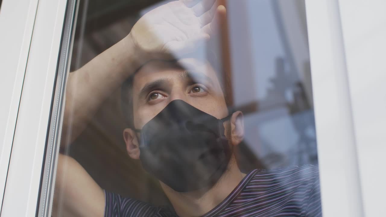 Stock Video Man With Mask Looking Out From The Windo Animated Wallpaper