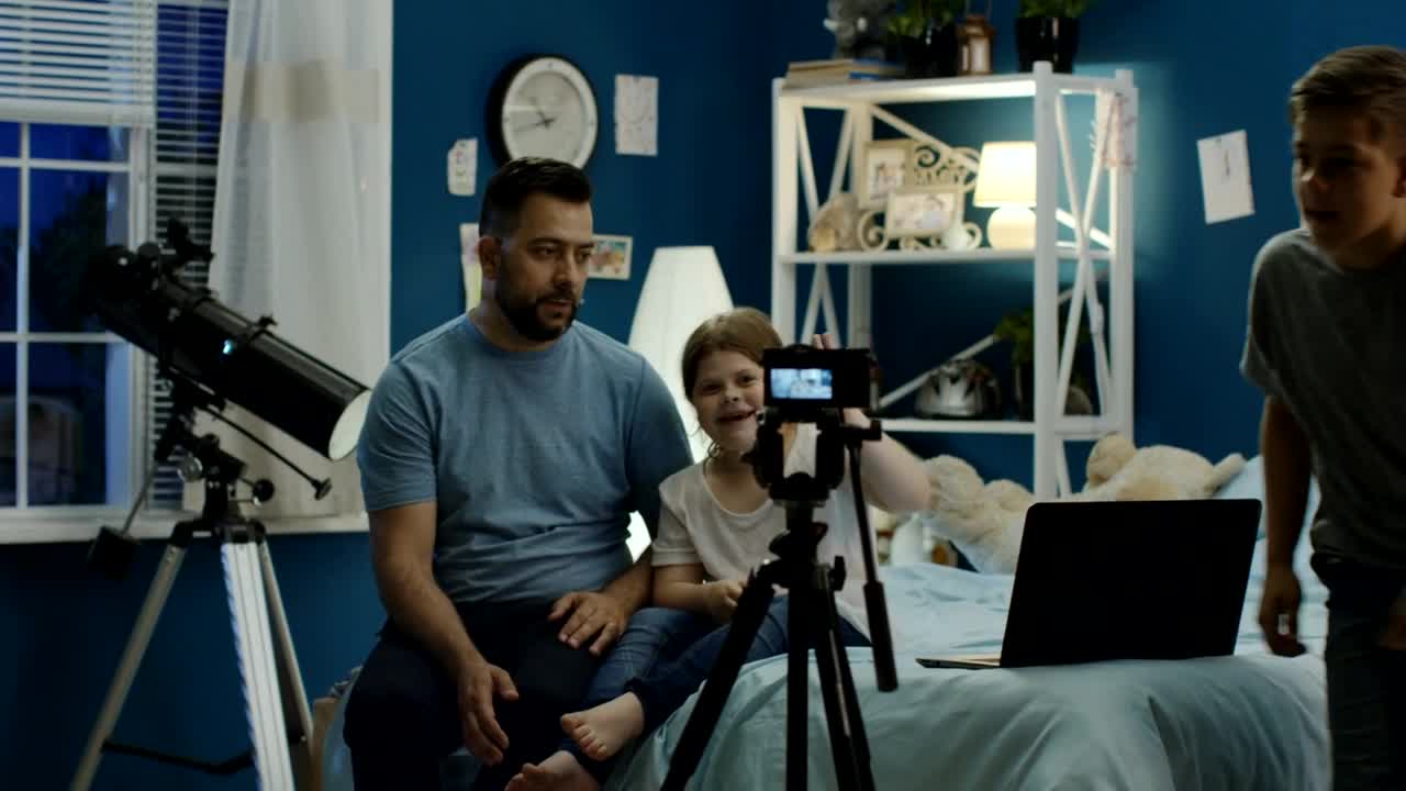 Stock Video Man With Kids Making A Video At Hom Animated Wallpaper