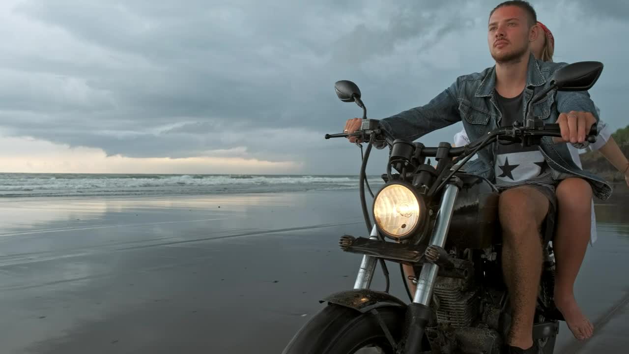 Stock Video Man With His Girlfriend Riding Motorcycle On Beac Animated Wallpaper