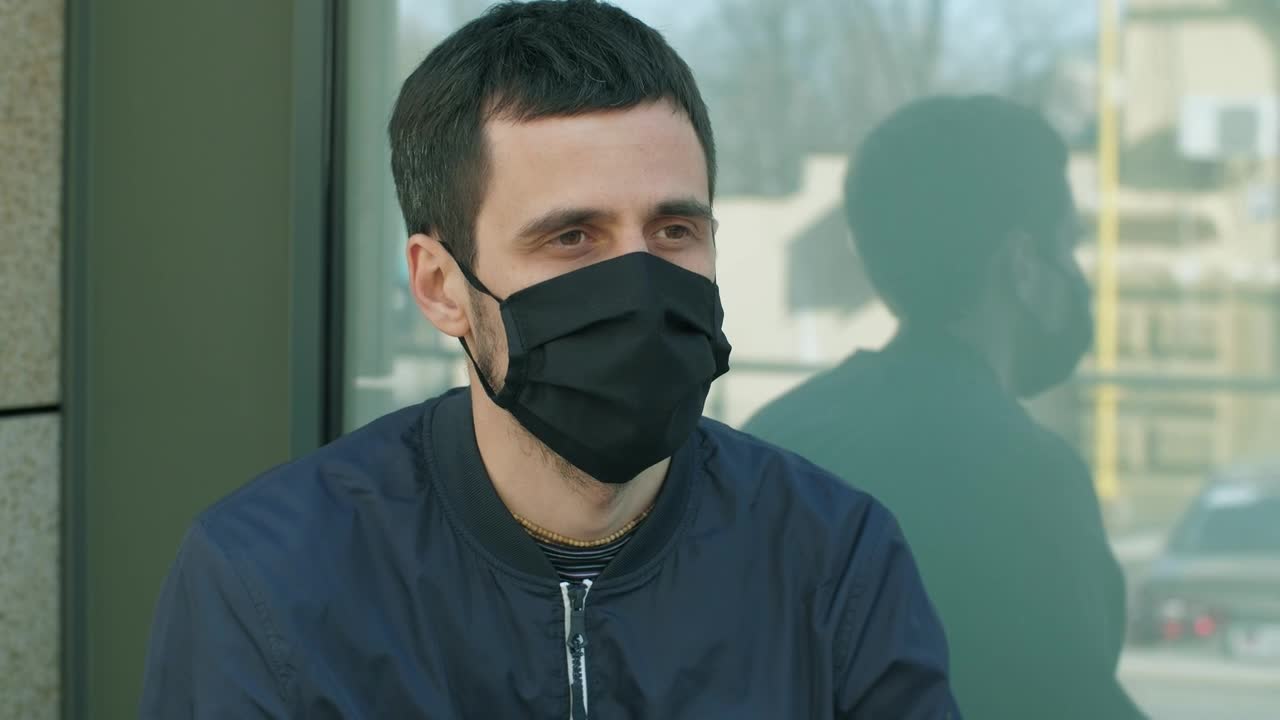 Stock Video Man With Fever In The Street Wearing Mas Animated Wallpaper