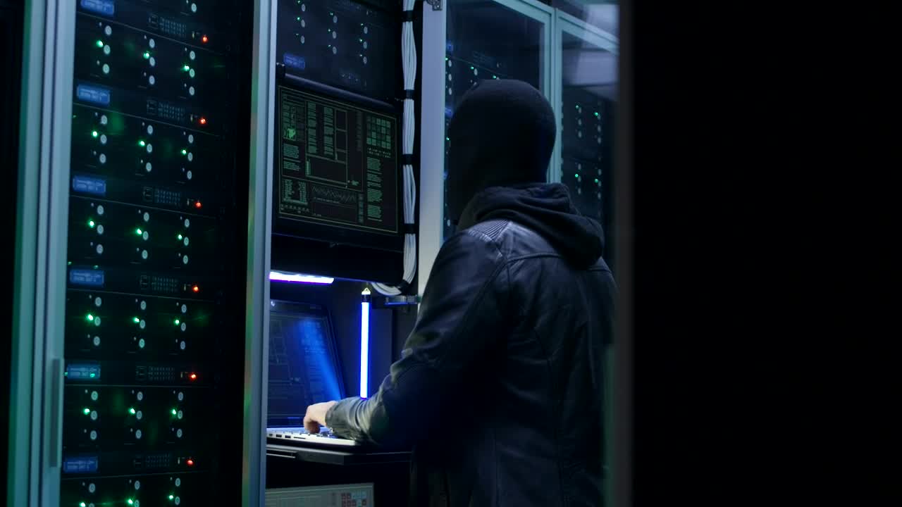 Stock Video Man With Face Mask Hacking A Data Cente Animated Wallpaper