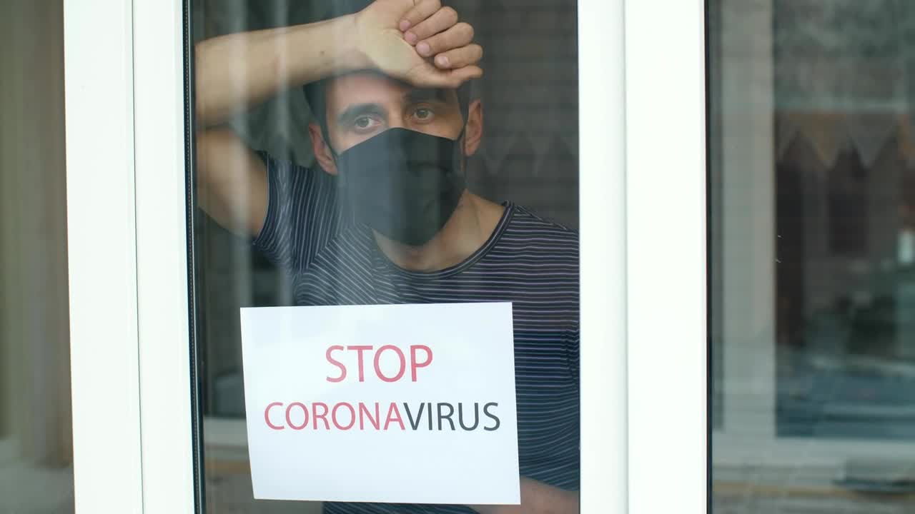 Stock Video Man With Coronavirus Sign In The Windo Animated Wallpaper