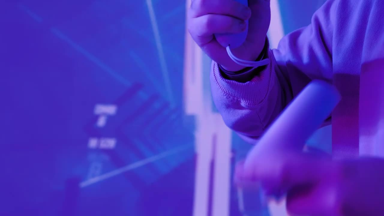 Stock Video Man With Controllers In A Gamer Environmen Animated Wallpaper