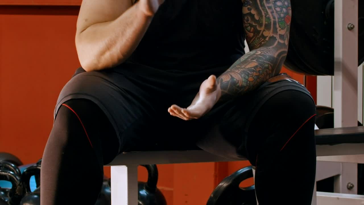 Stock Video Man With A Tattoo Clapping His Hand Animated Wallpaper