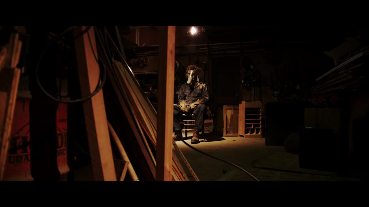 Stock Video Man With A Mask Sitting On A Chai Animated Wallpaper