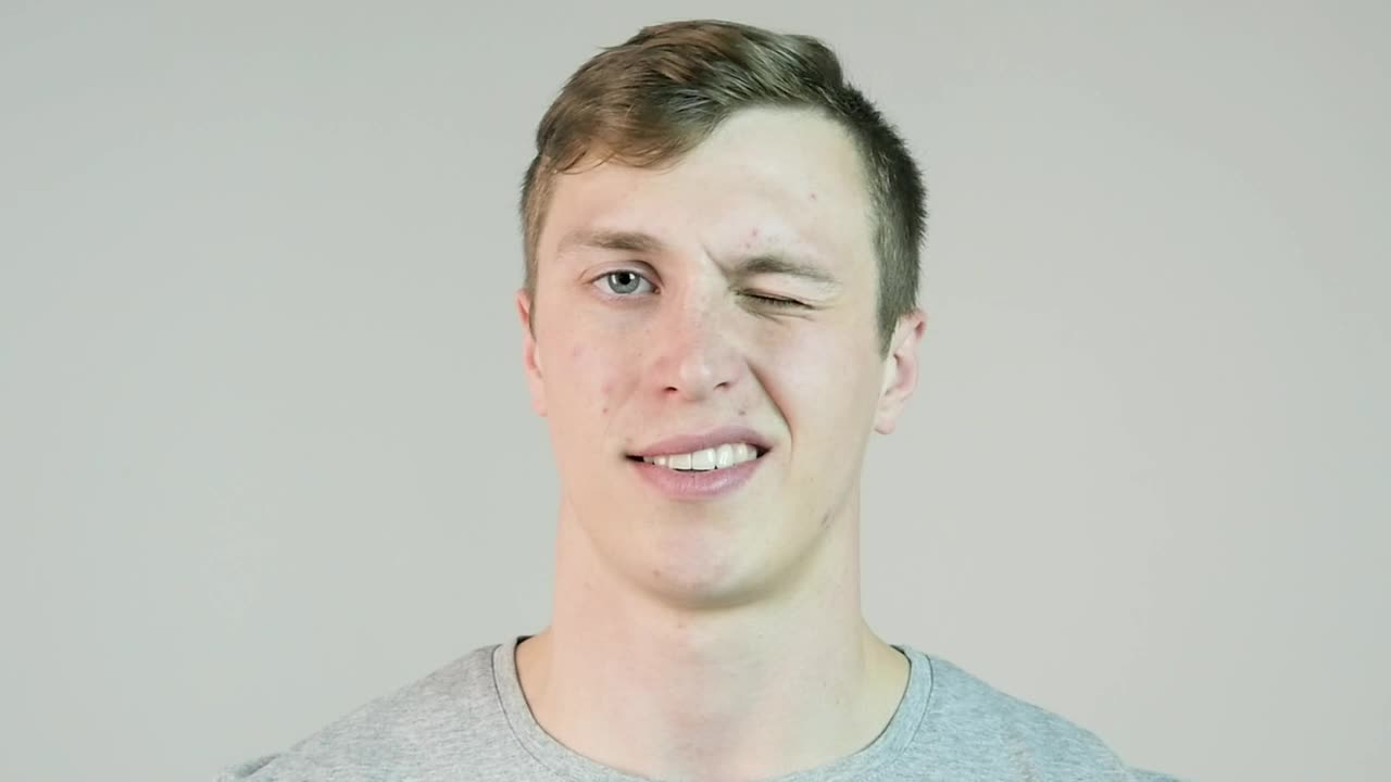 Stock Video Man Winking Against An Isolated Backgroun Animated Wallpaper