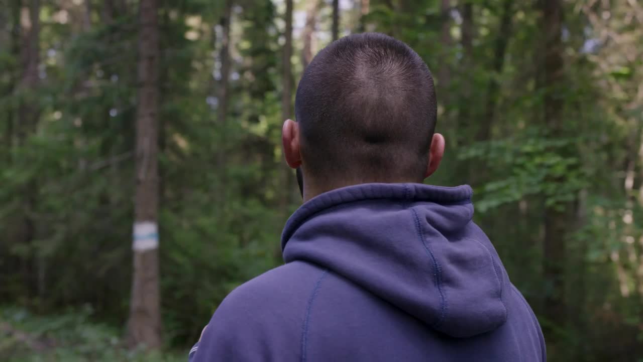 Stock Video Man Wearing Headphones In Woodlan Animated Wallpaper