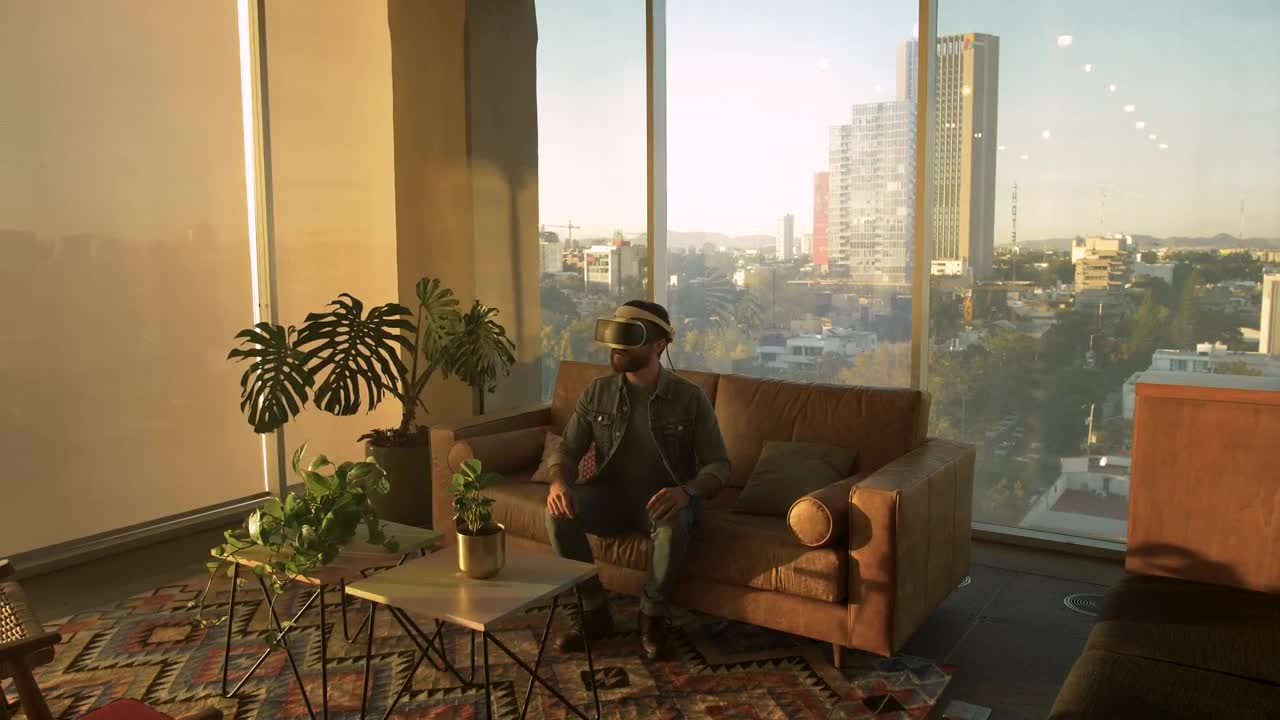 Stock Video Man Wearing Augmented Reality Glasses In An Apartmen Animated Wallpaper