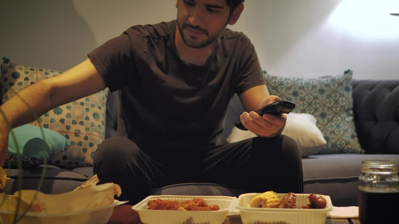 Stock Video Man Watching Tv And Eating Fast Foo Animated Wallpaper