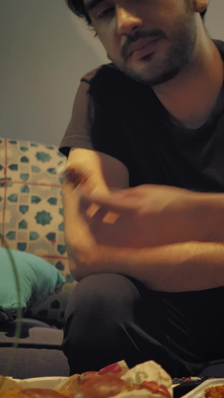 Stock Video Man Watching Tv While Eating Nuggets With Dressin Animated Wallpaper