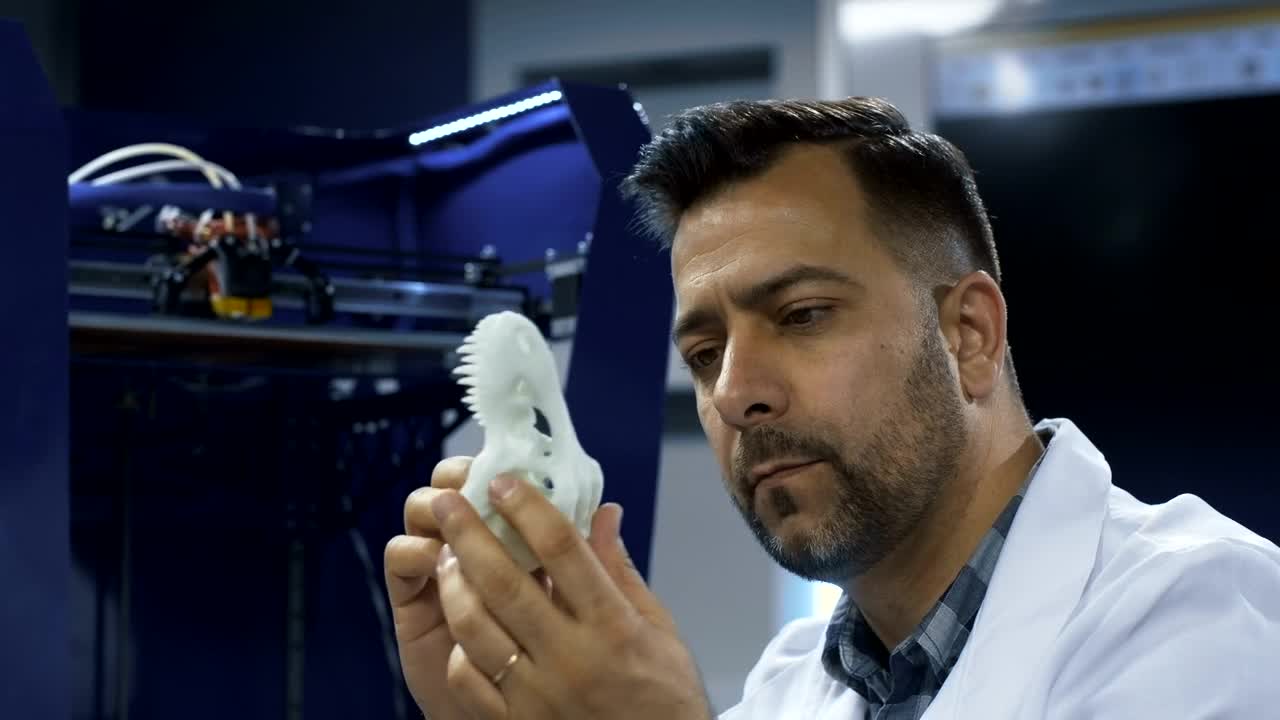 Stock Video Man Watching That D Printer Skul Animated Wallpaper